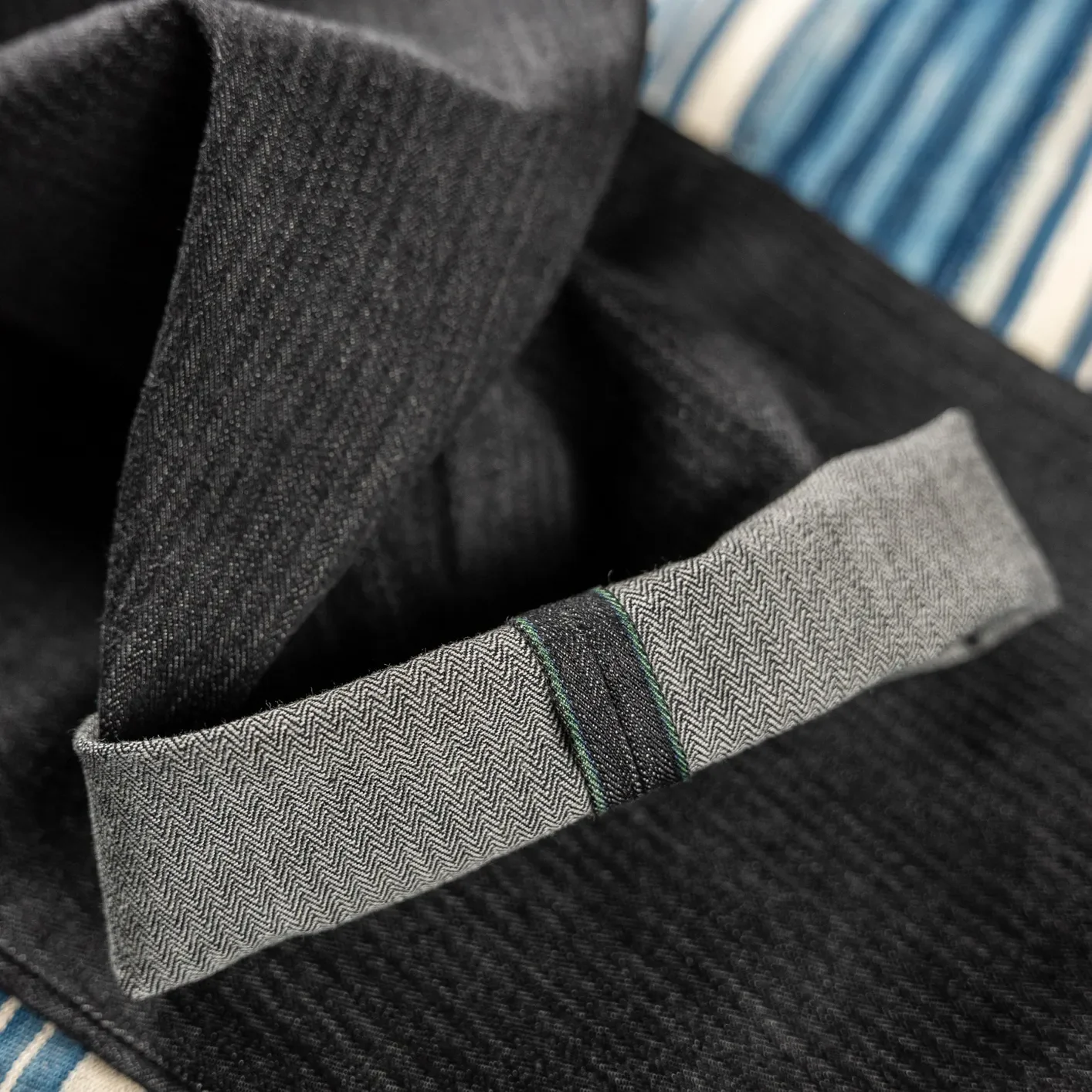 MotivMfg Pleat Herringbone Denim Trousers - Black / Classic Straight - Image 3